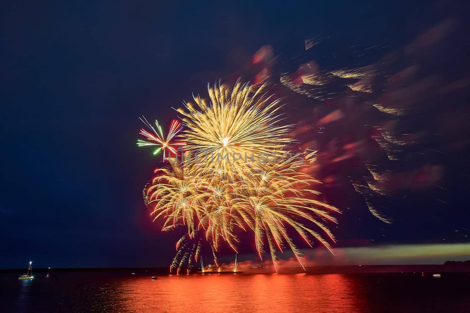 Colorful fireworks on the black sky background. High quality photo