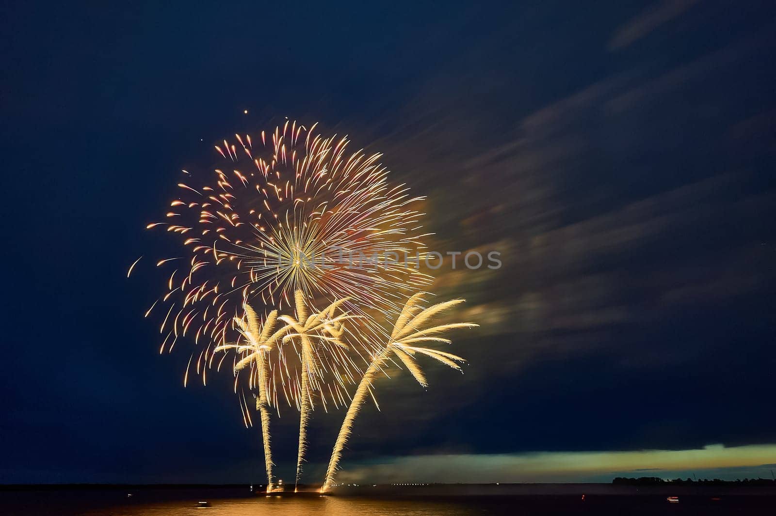 Colorful fireworks on the black sky background. High quality photo