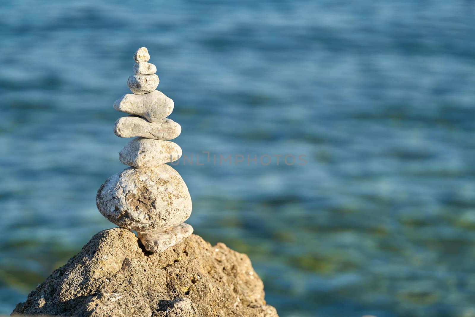 piled up stones and beautiful view of the Adriatic Sea near the town of Krk on the island of Krk in Croatia