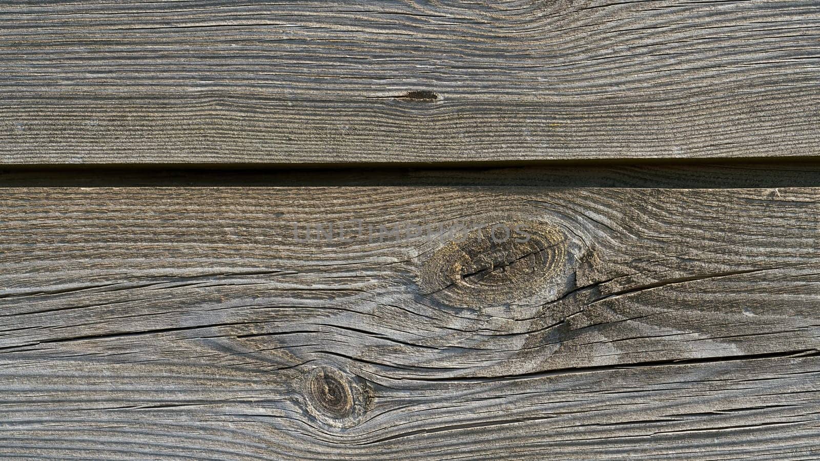 Boards of wood on an old weathered fence