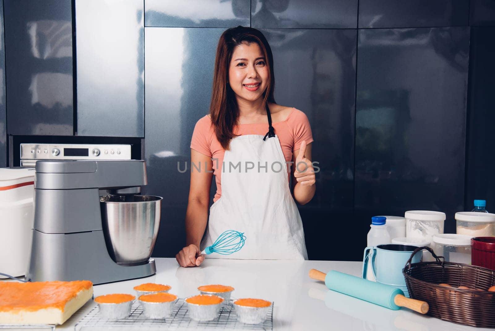 Portrait woman owner bakery shop in her kitchen