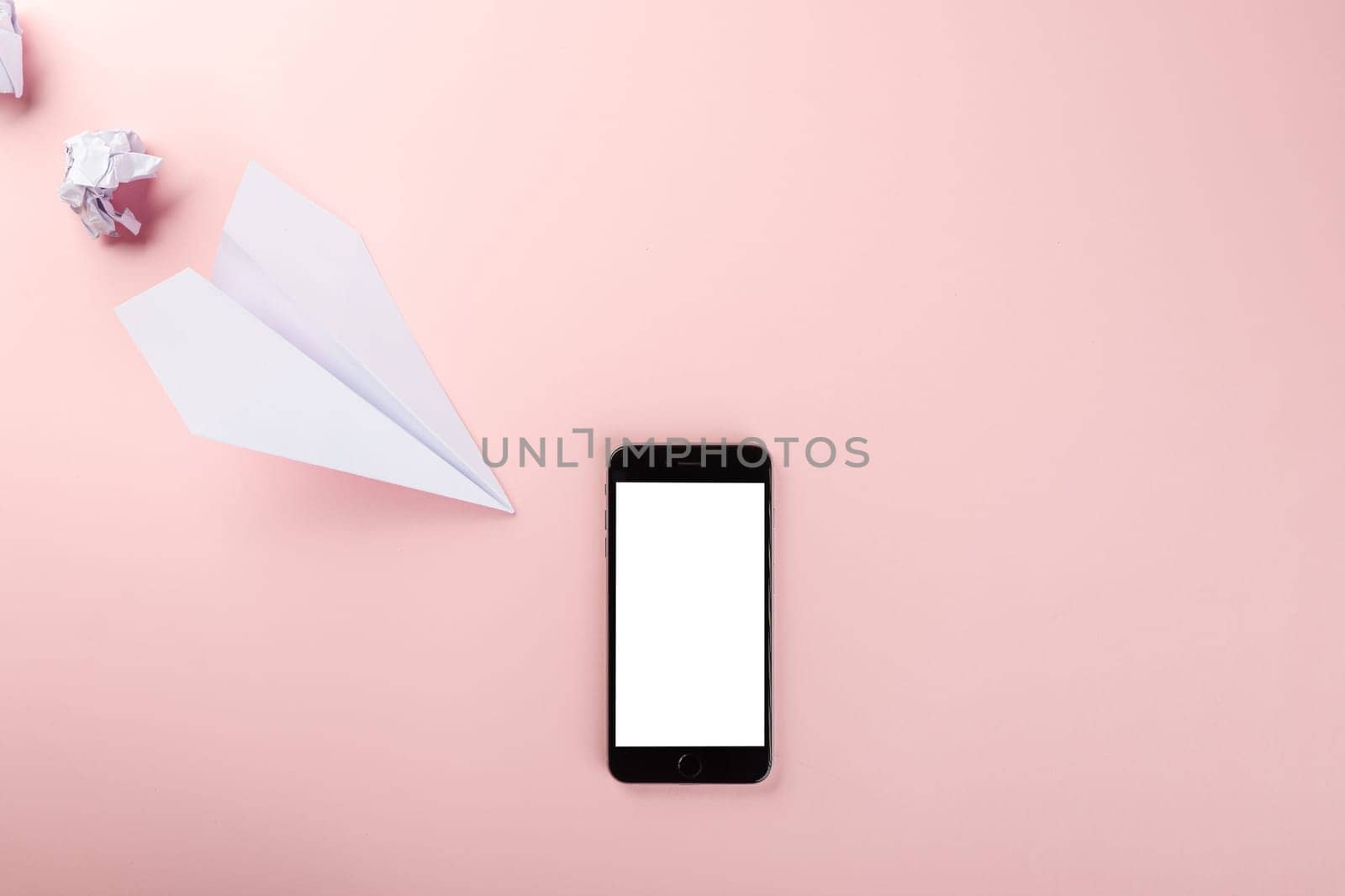 Paper plane letter document message. Top view mock up design of airplane travel and mobile phone, education or innovation origami plane with smartphone blank screen, isolated on pink background