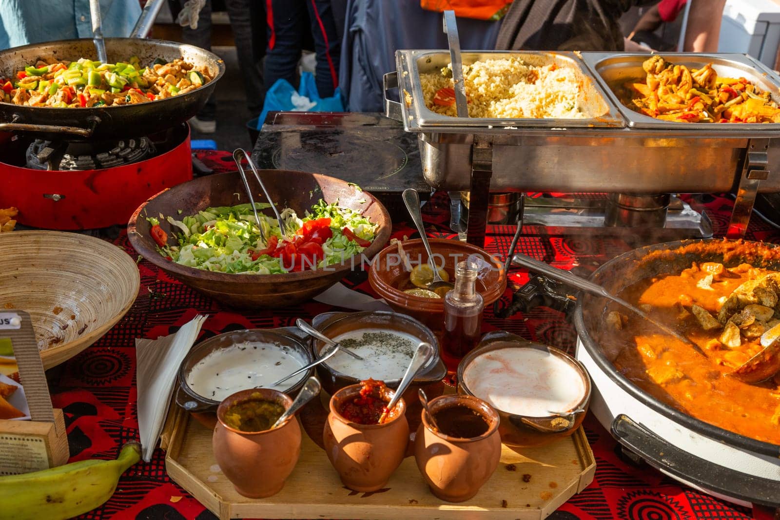 Cheff cooking fusion international cusine on street stall on international street food festival of Odprta kuhna, Open kitchen event, in Ljubljana, Slovenia.