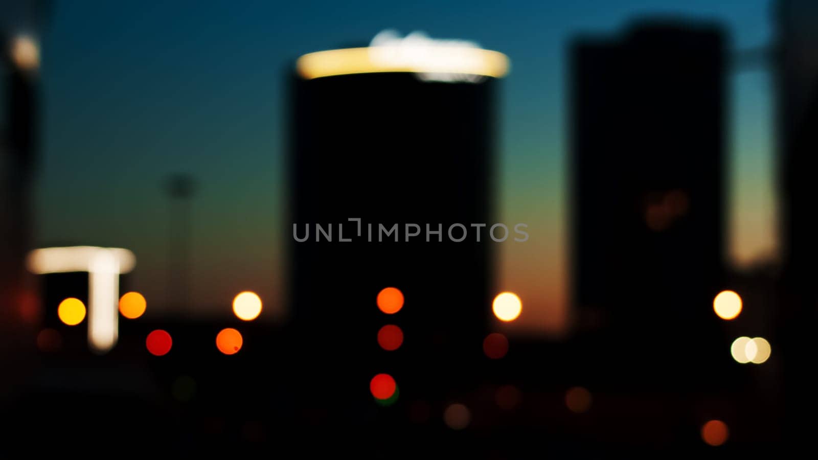 mysterious colored lights of the night city. blurry focus
