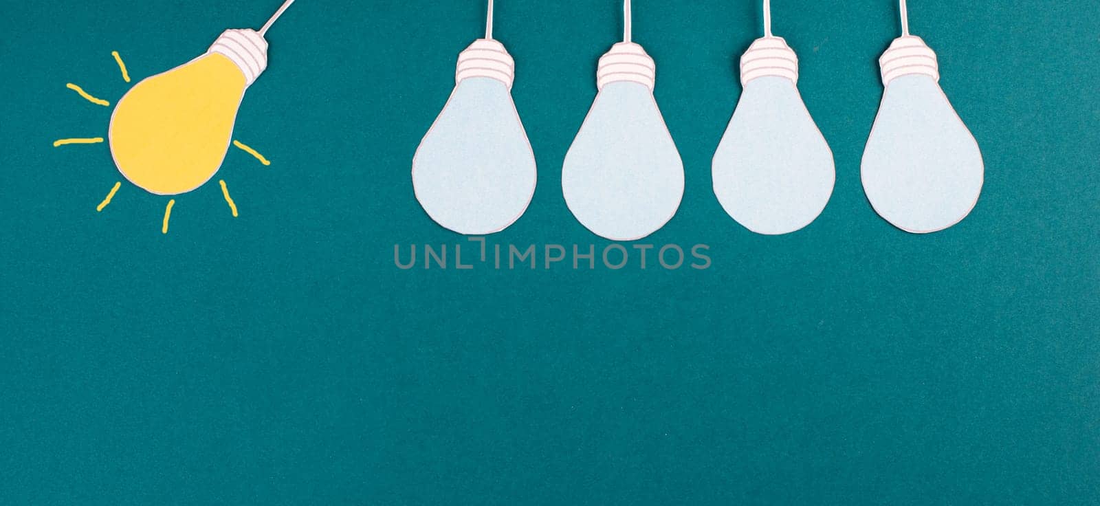 Standing out from the crowd, having a new idea, light bulb concept, be different, leadership