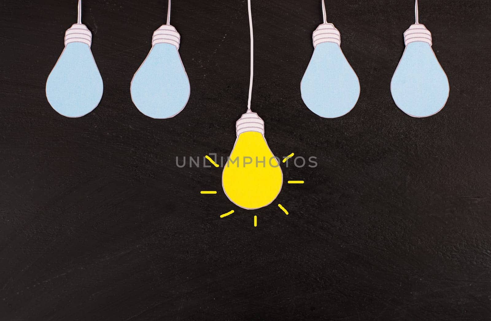 Standing out from the crowd, having a new idea, light bulb concept, be different, leadership