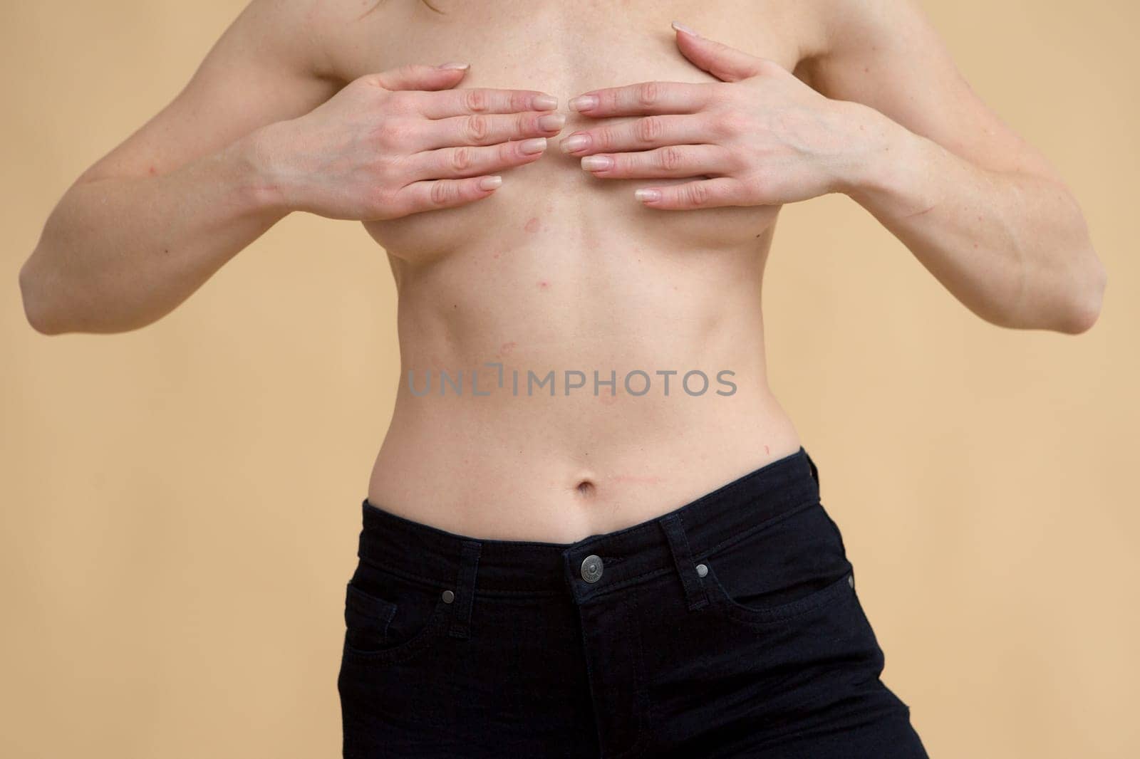 Close up of fit woman torso with sweat on skin after workout