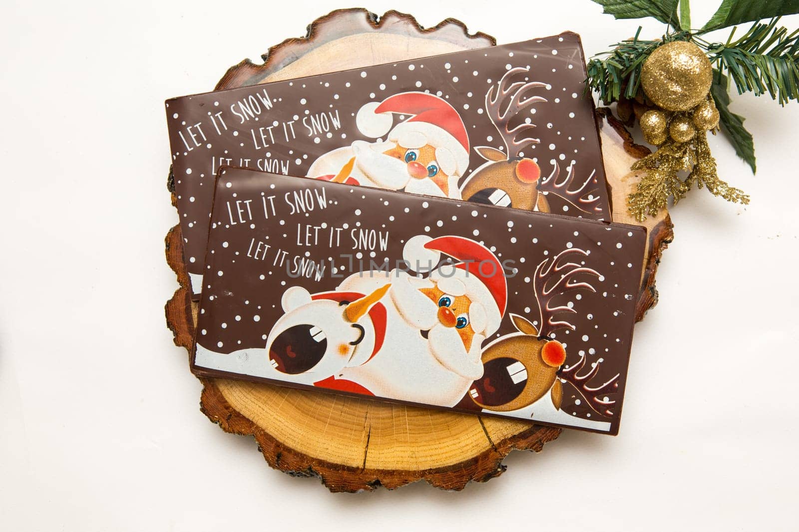 Milk and dark chocolate with a Christmas theme .
