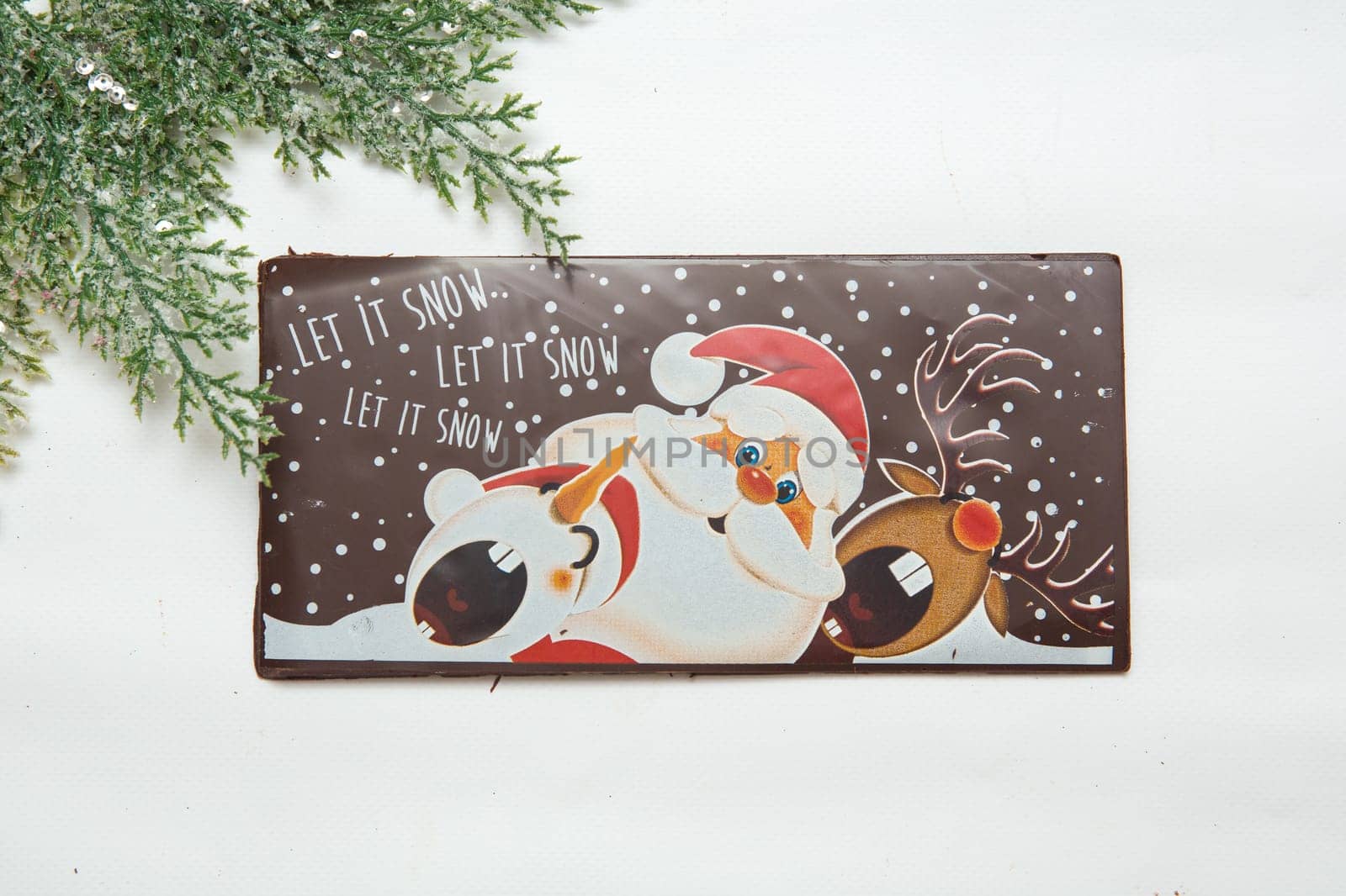Milk and dark chocolate with a Christmas theme .