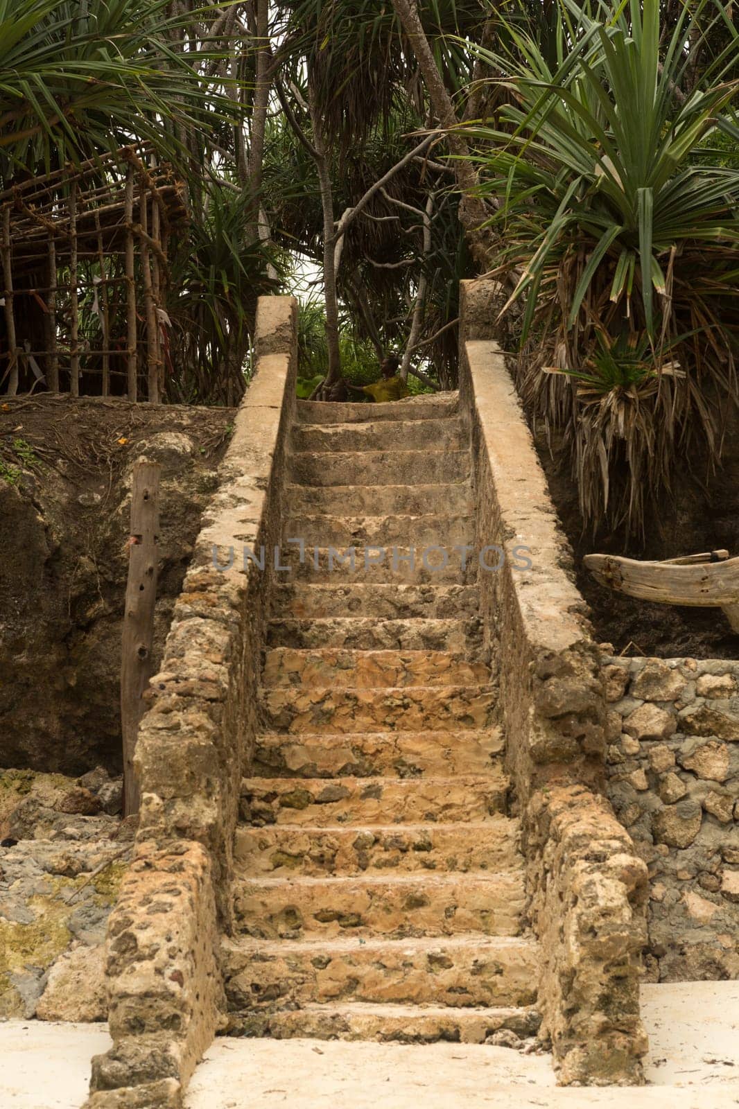 Stone steps leading up to the beach. Stand, Zanzibar Urban West, Tanzania.