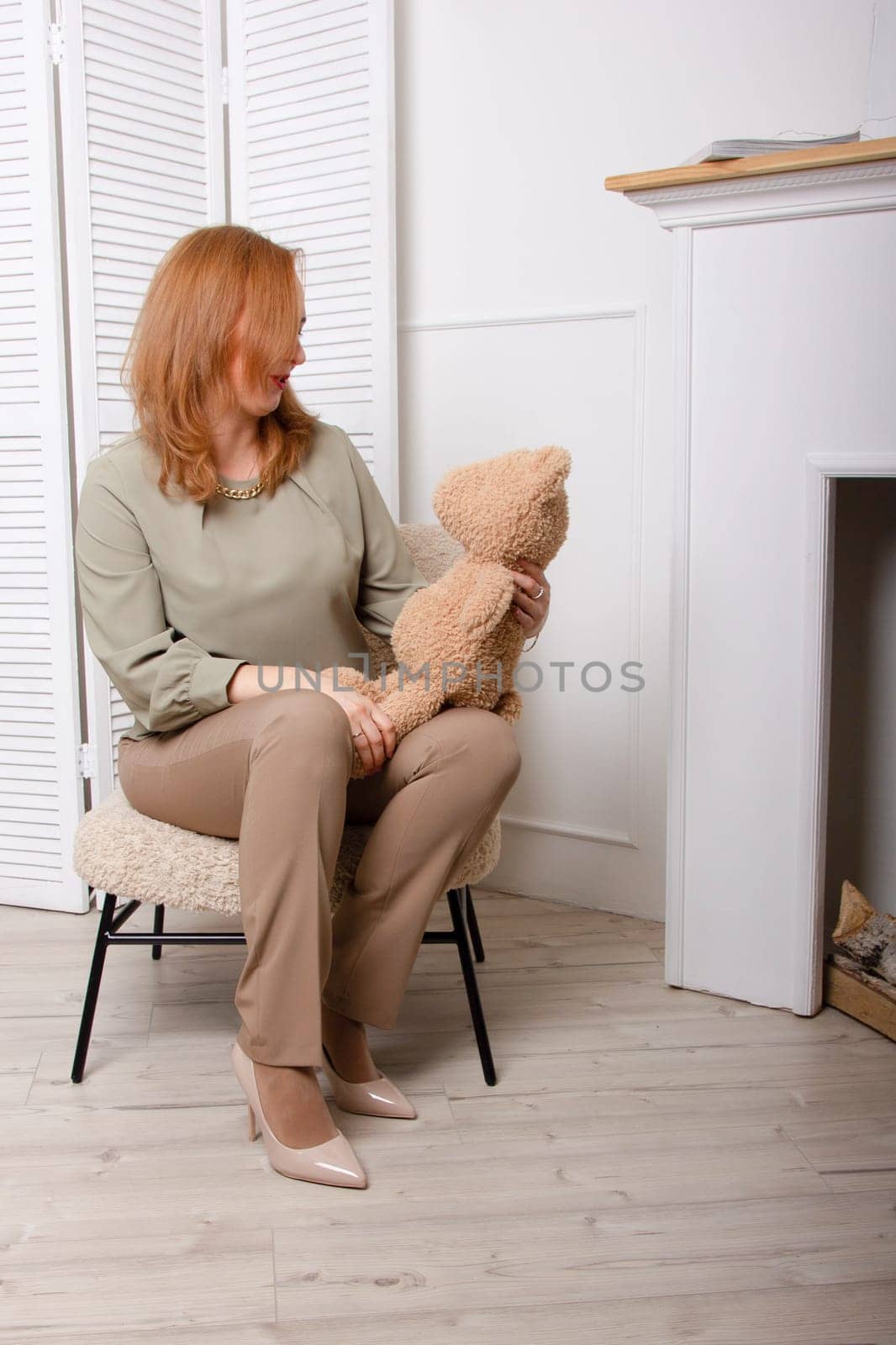 Young beautiful woman hold her lovely teddy bear.