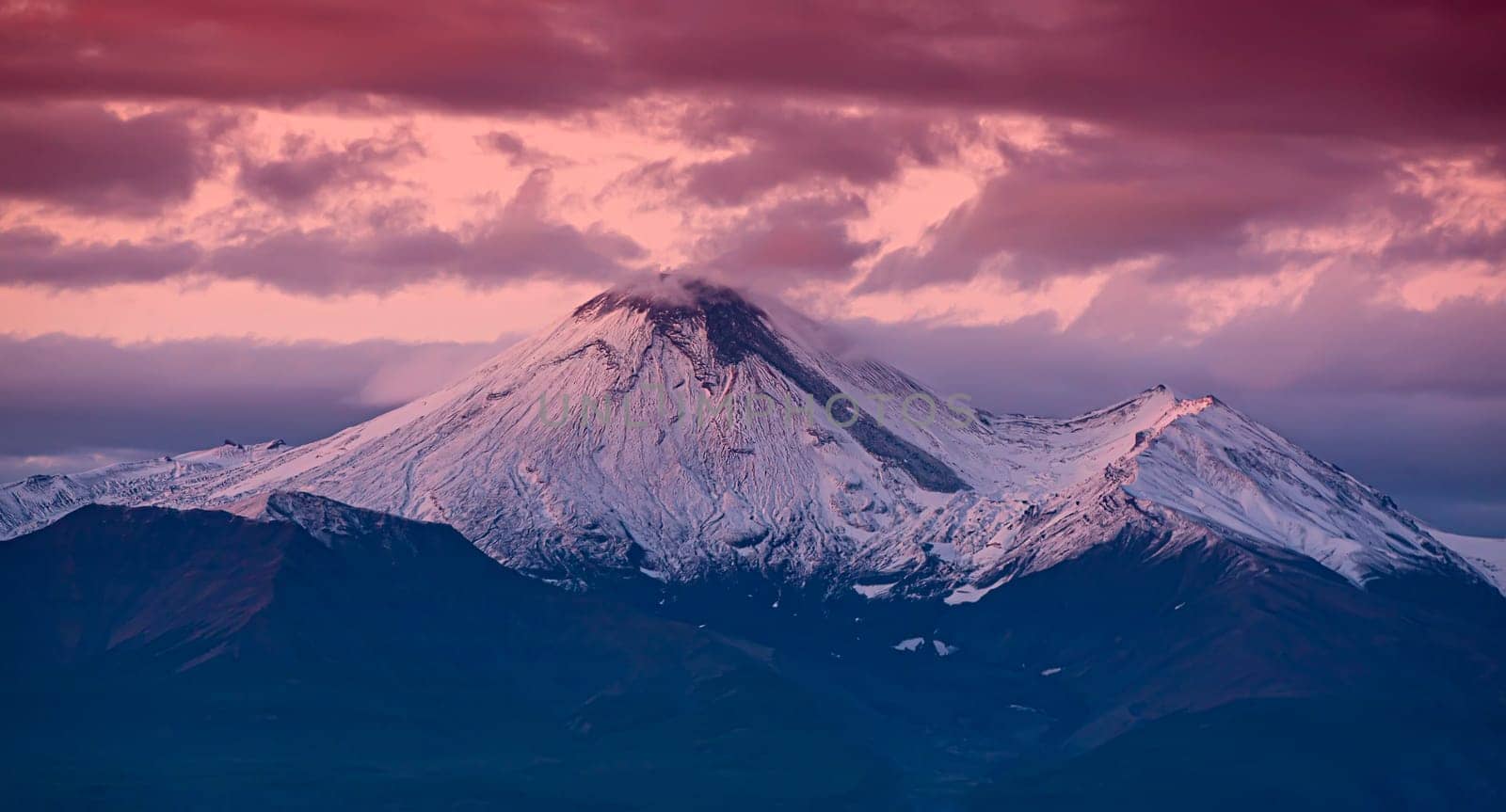 The Avachinsky volcano in Kamchatka in the autumn with a snow-covered top