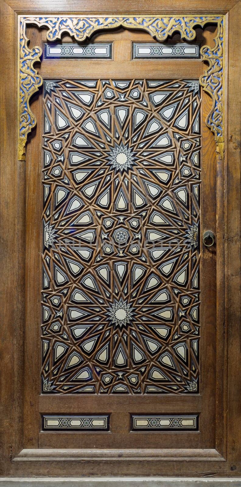 Side door of Minbar of historic public Mosque of Al Rifai, with wooden arabesque decorations tongue and groove assembled, inlaid with ivory and ebony, Old Cairo, Egypt