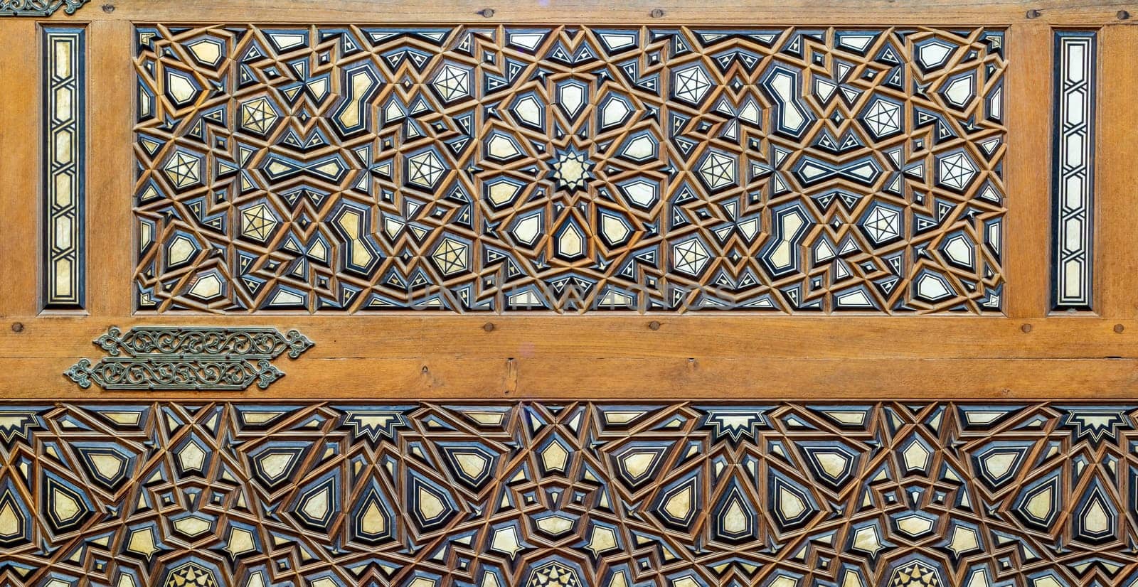 Wooden arabesque decorations tongue and groove assembled, inlaid with ivory and ebony, on Minbar of historic public Mosque of Al Rifai, Old Cairo, Egypt
