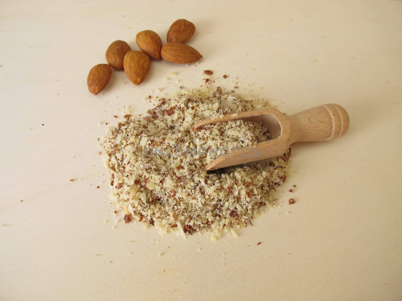 Almond flour, ground almonds on a wooden board