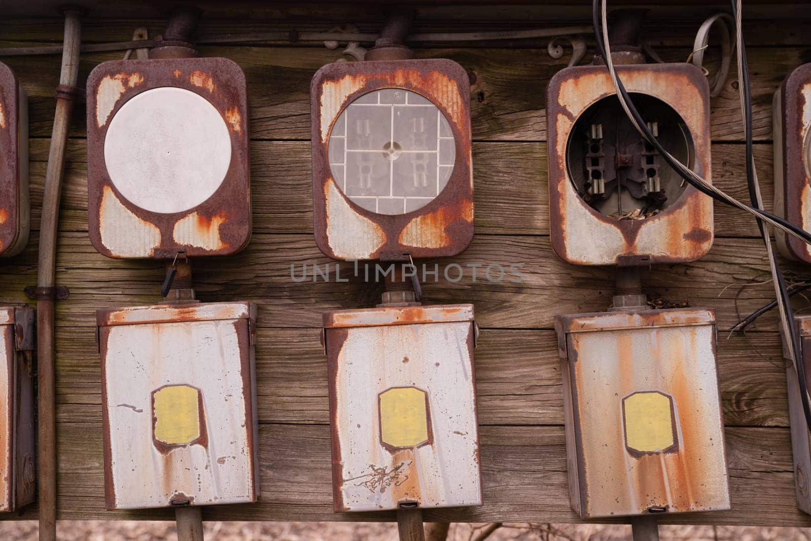 Electrical boxes exposed outside rust away going unused