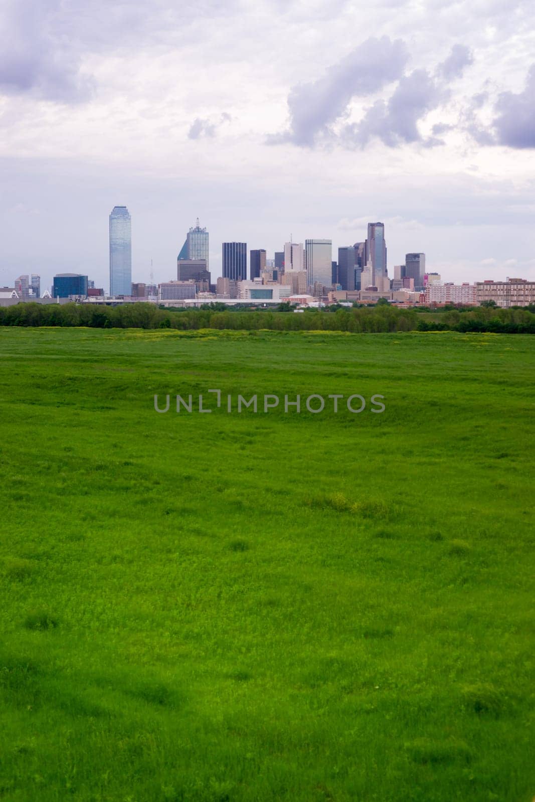 A storm brews over the buildings of downtown Dallas Texas