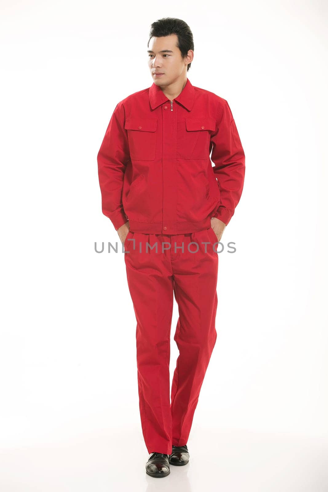 The young engineer various occupation clothing standing in front of a white background
