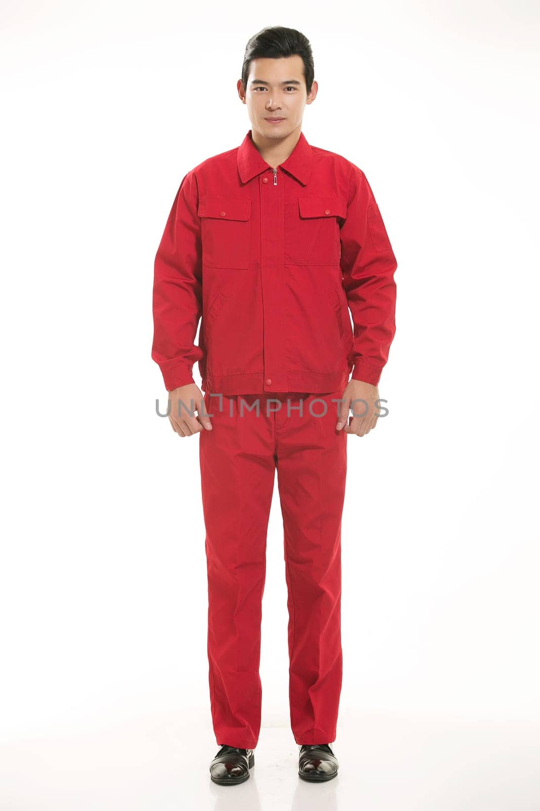 The young engineer various occupation clothing standing in front of a white background
