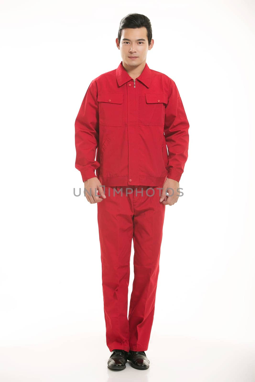 The young engineer various occupation clothing standing in front of a white background