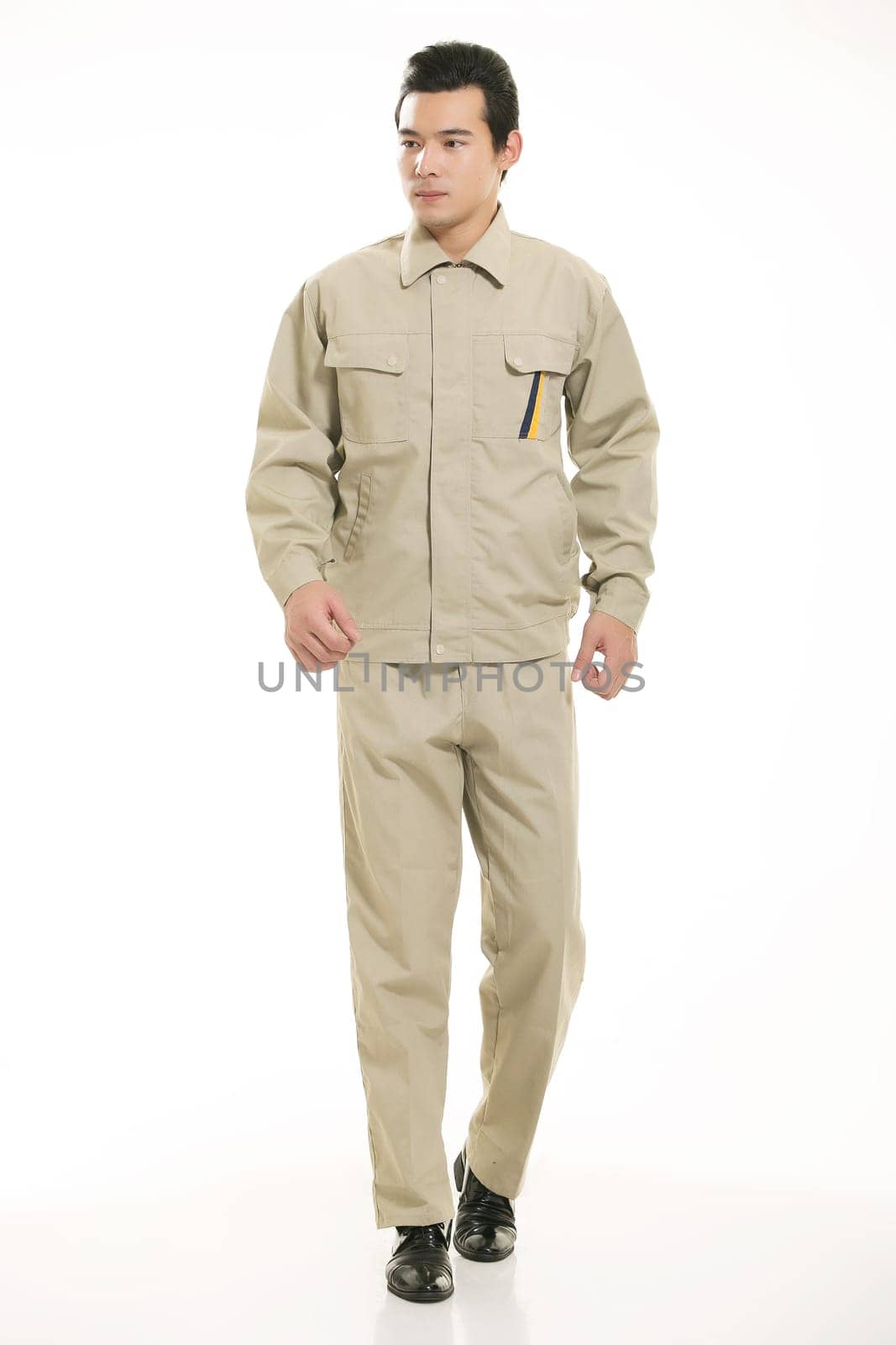 The young engineer various occupation clothing standing in front of a white background