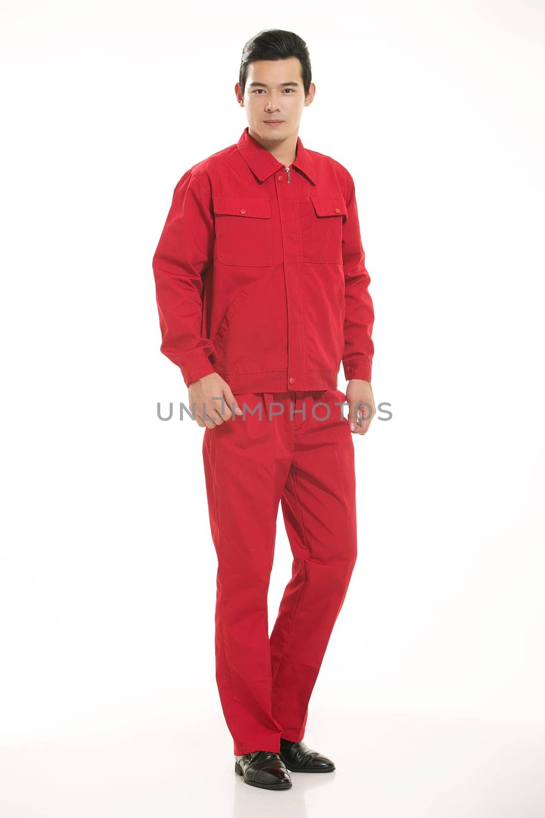 The young engineer various occupation clothing standing in front of a white background