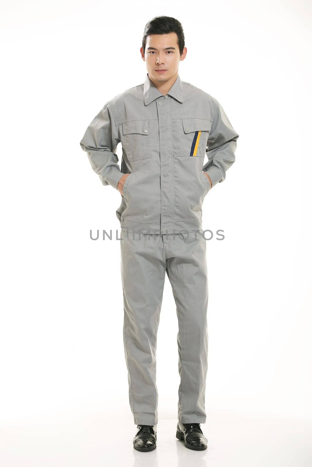 The young engineer various occupation clothing standing in front of a white background