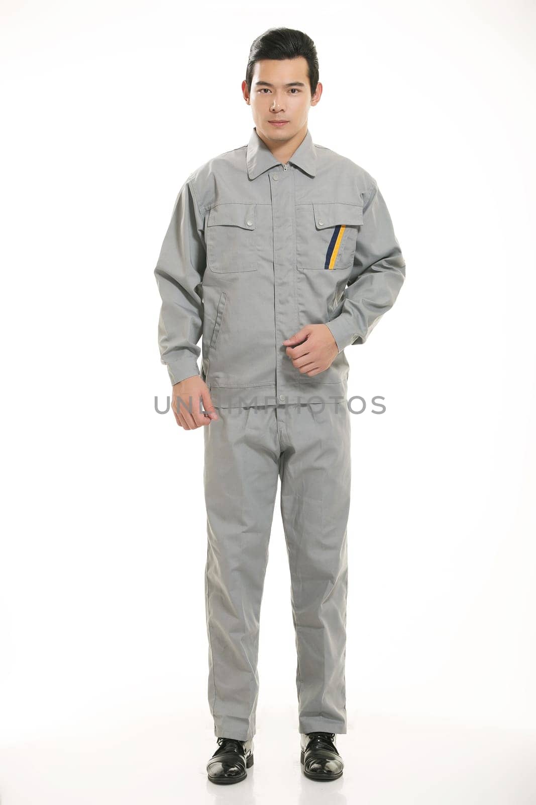 The young engineer various occupation clothing standing in front of a white background