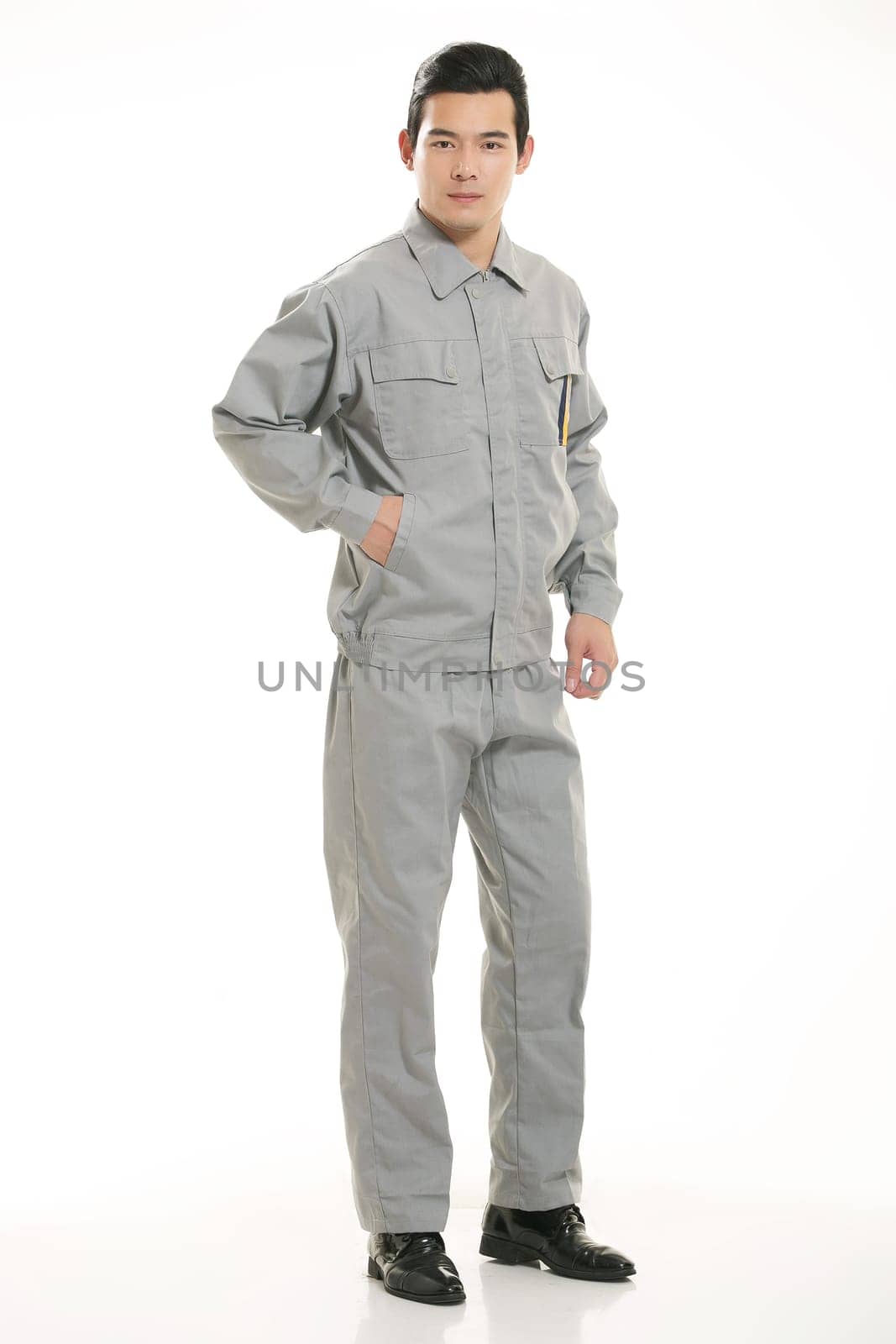 The young engineer various occupation clothing standing in front of a white background