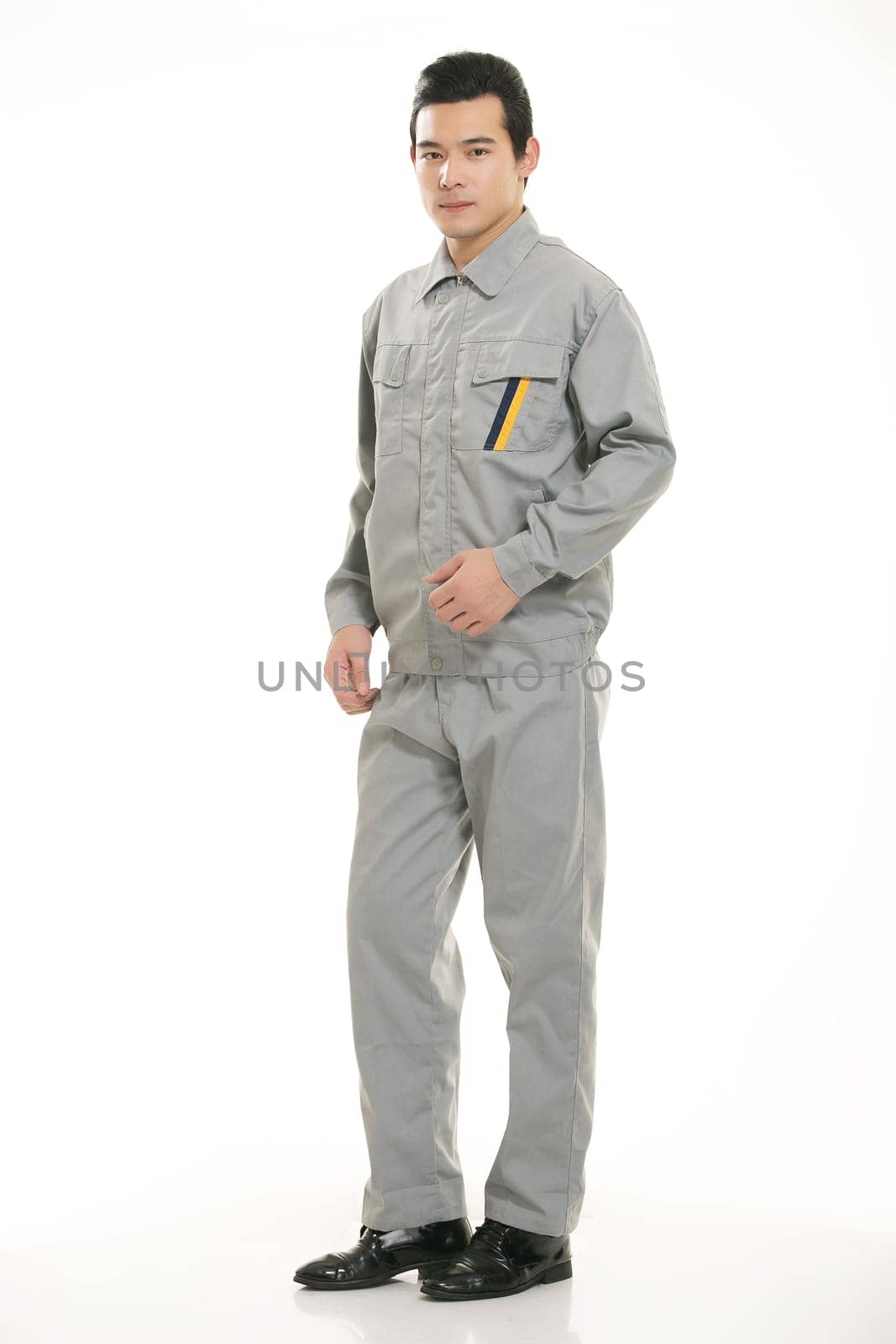 The young engineer various occupation clothing standing in front of a white background
