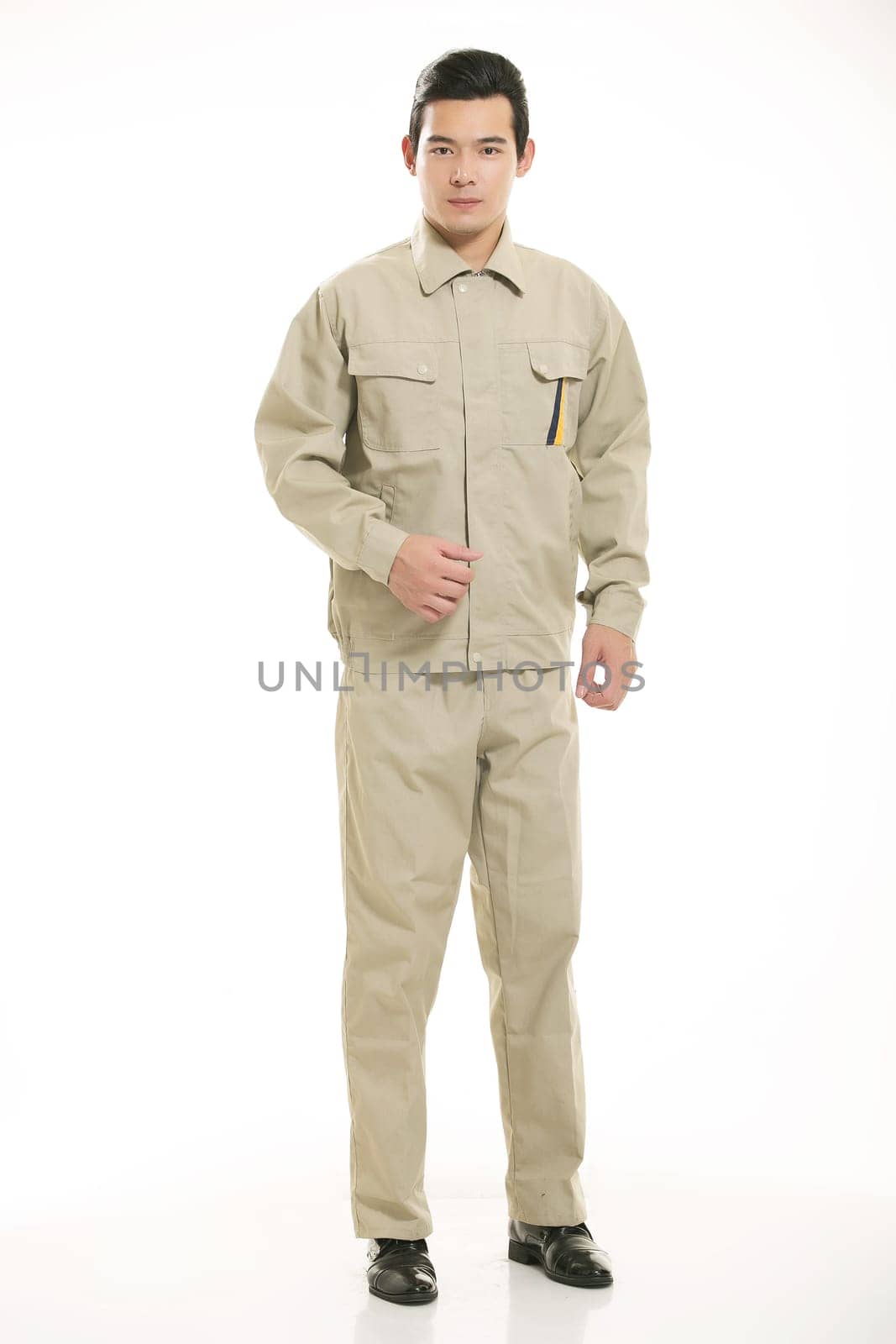 The young engineer various occupation clothing standing in front of a white background