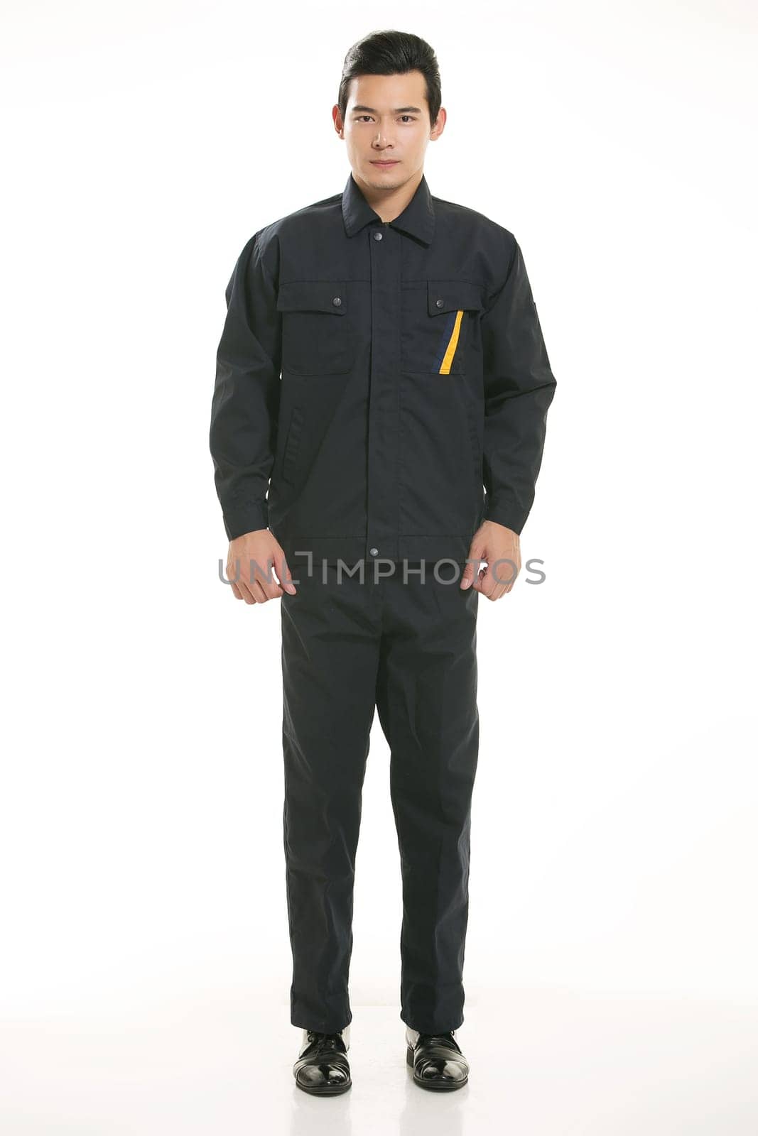 The young engineer various occupation clothing standing in front of a white background
