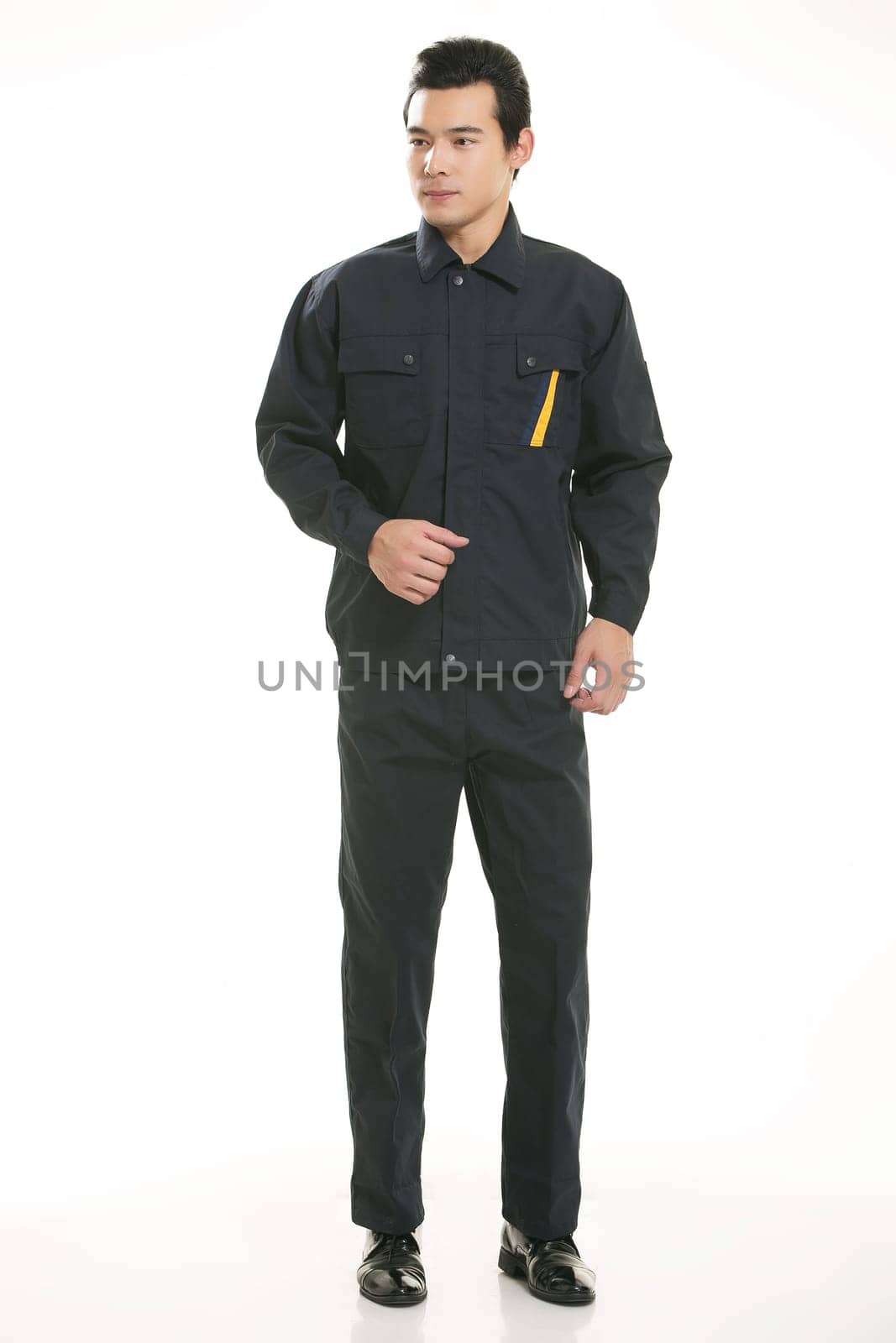 The young engineer various occupation clothing standing in front of a white background