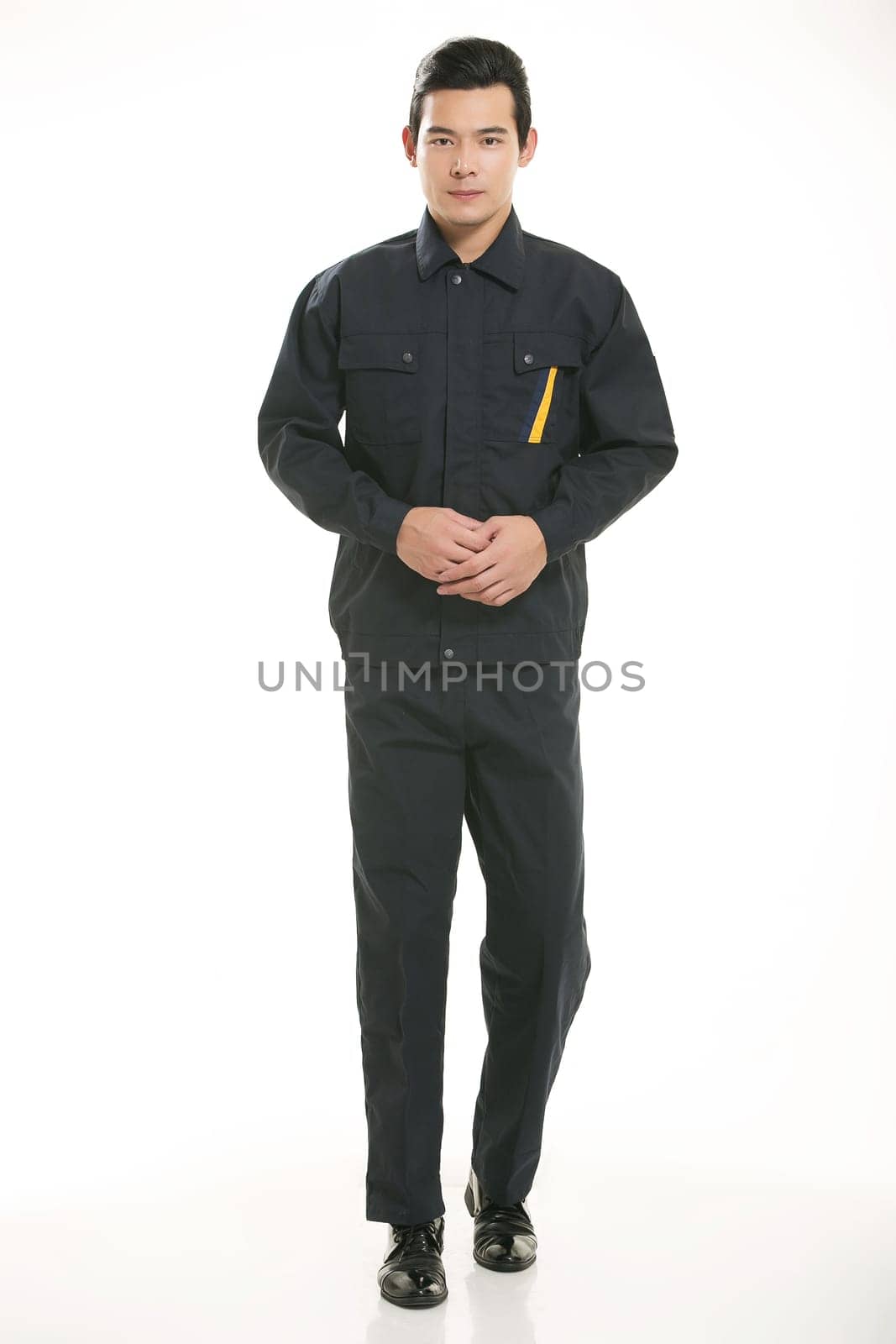 The young engineer various occupation clothing standing in front of a white background