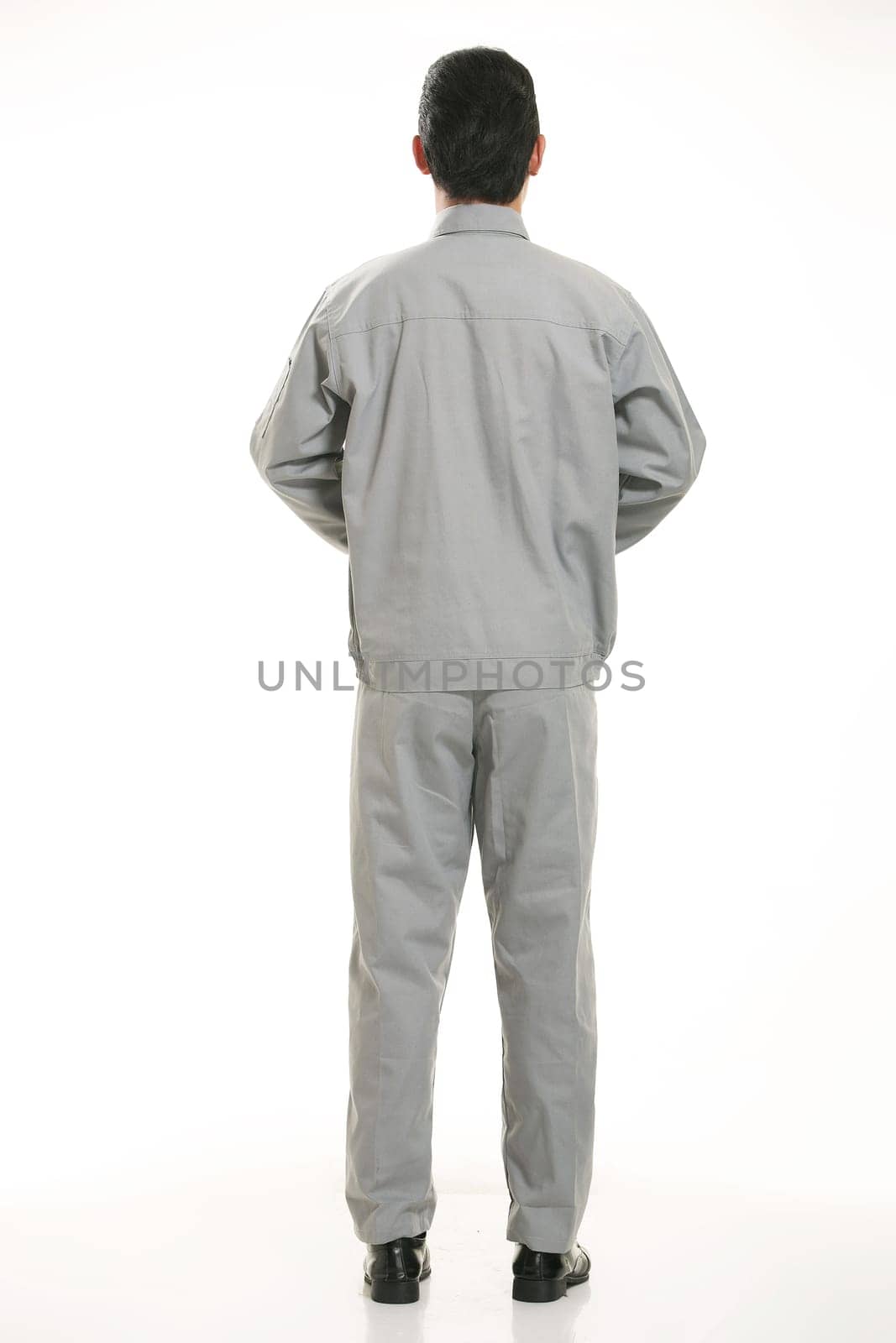 The young engineer various occupation clothing standing in front of a white background