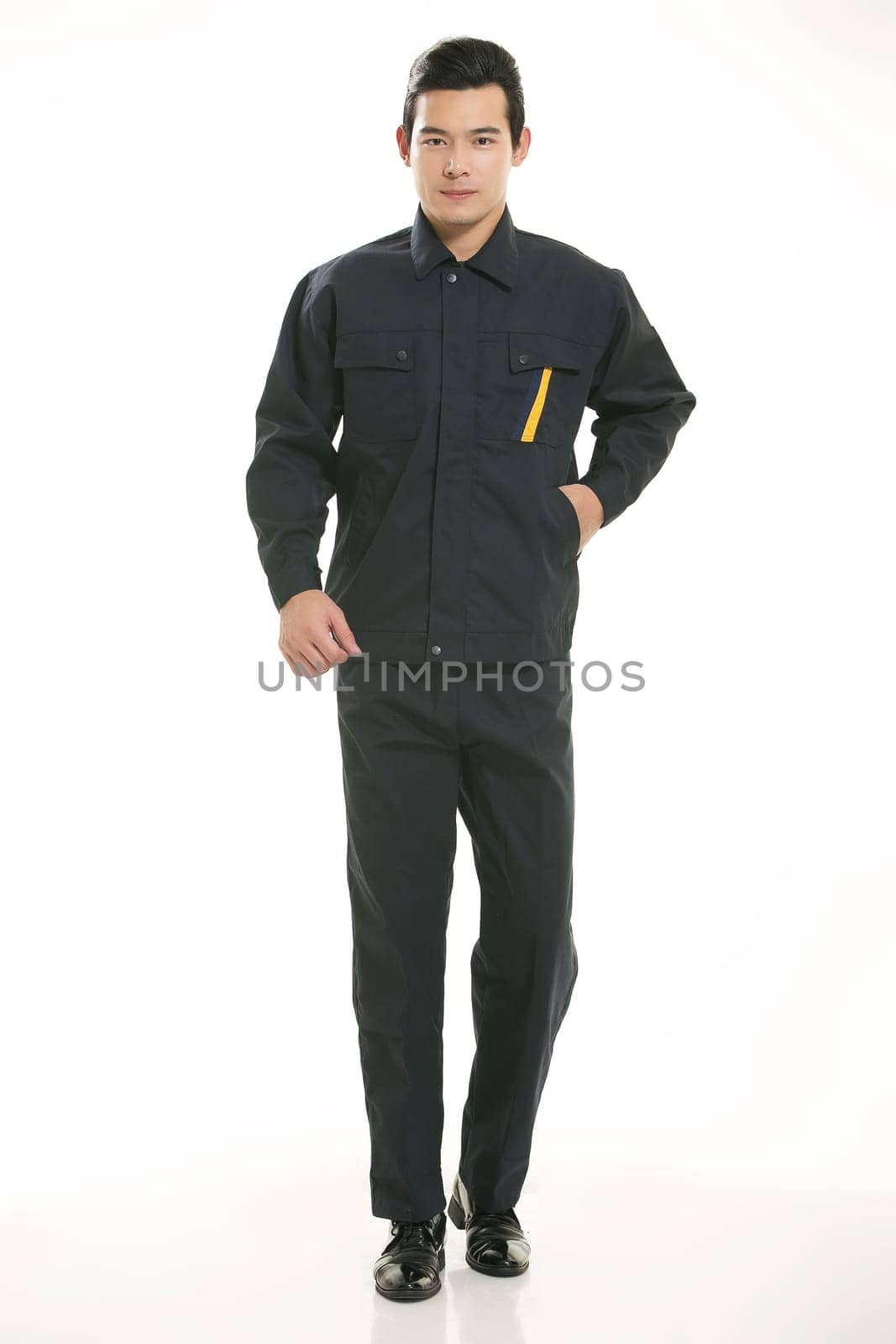 The young engineer various occupation clothing standing in front of a white background