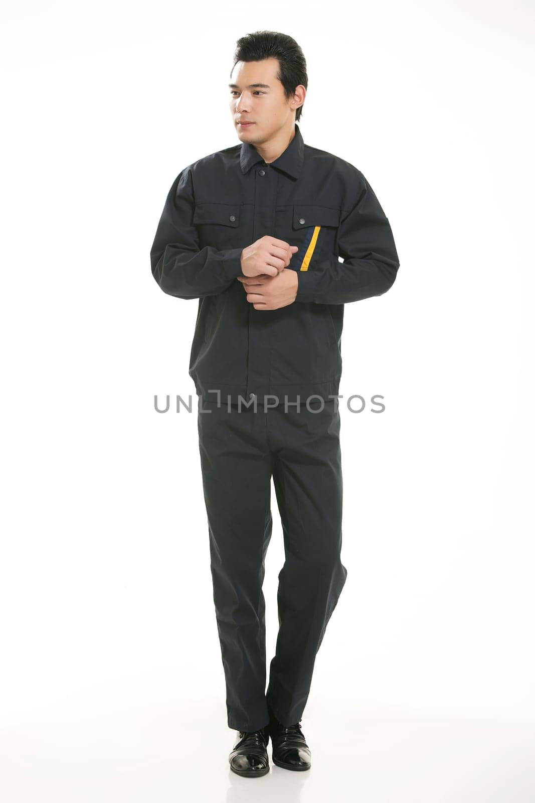 The young engineer various occupation clothing standing in front of a white background
