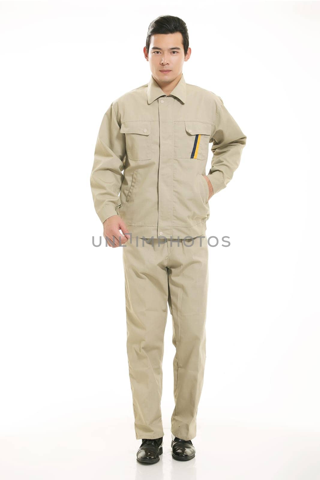 The young engineer various occupation clothing standing in front of a white background