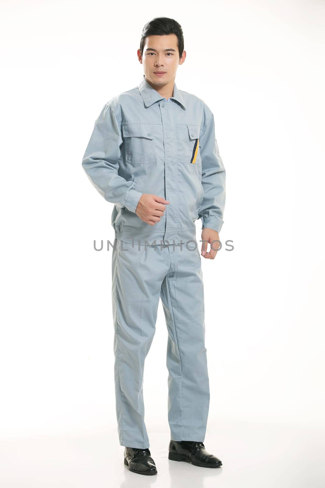 The young engineer various occupation clothing standing in front of a white background
