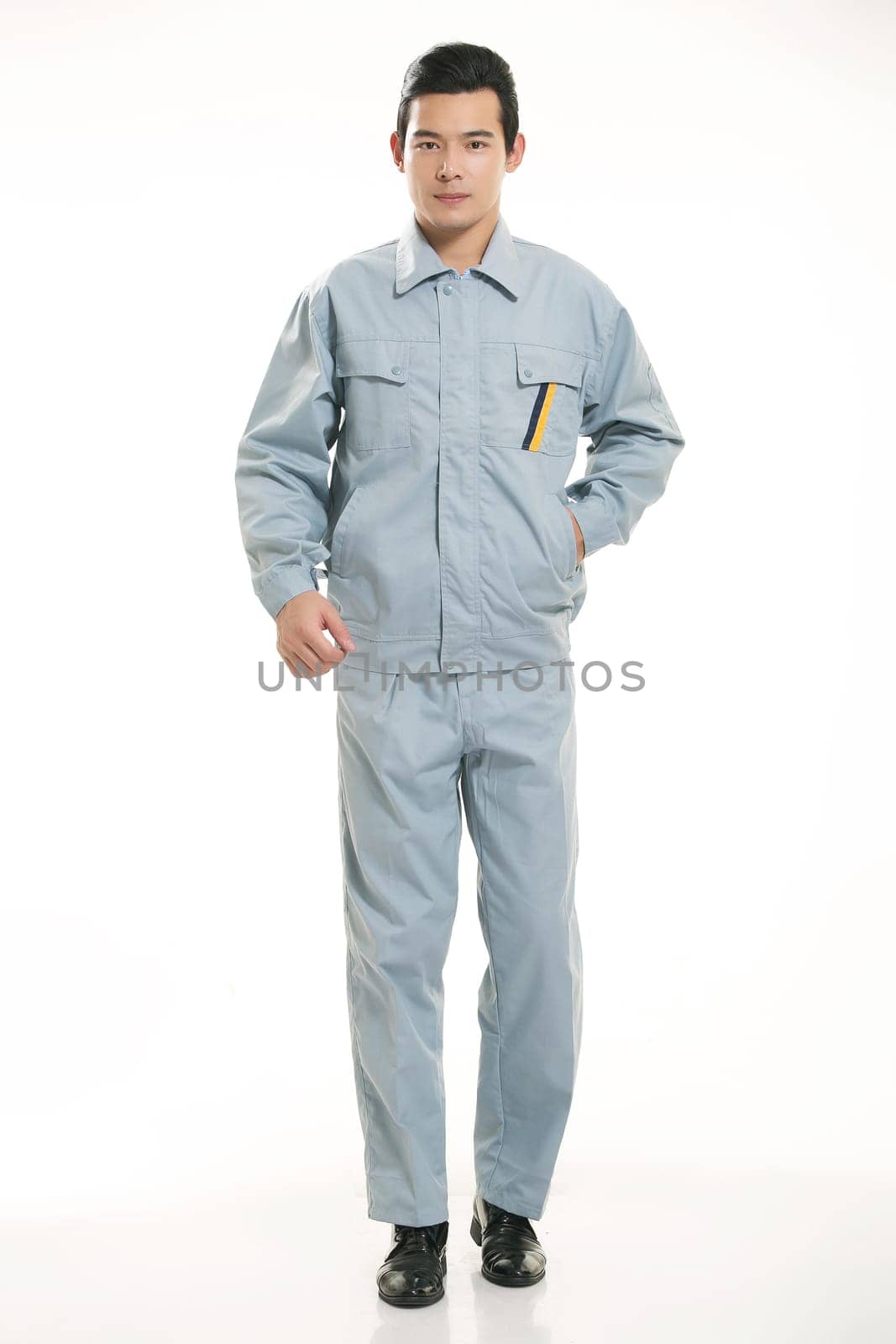 The young engineer various occupation clothing standing in front of a white background