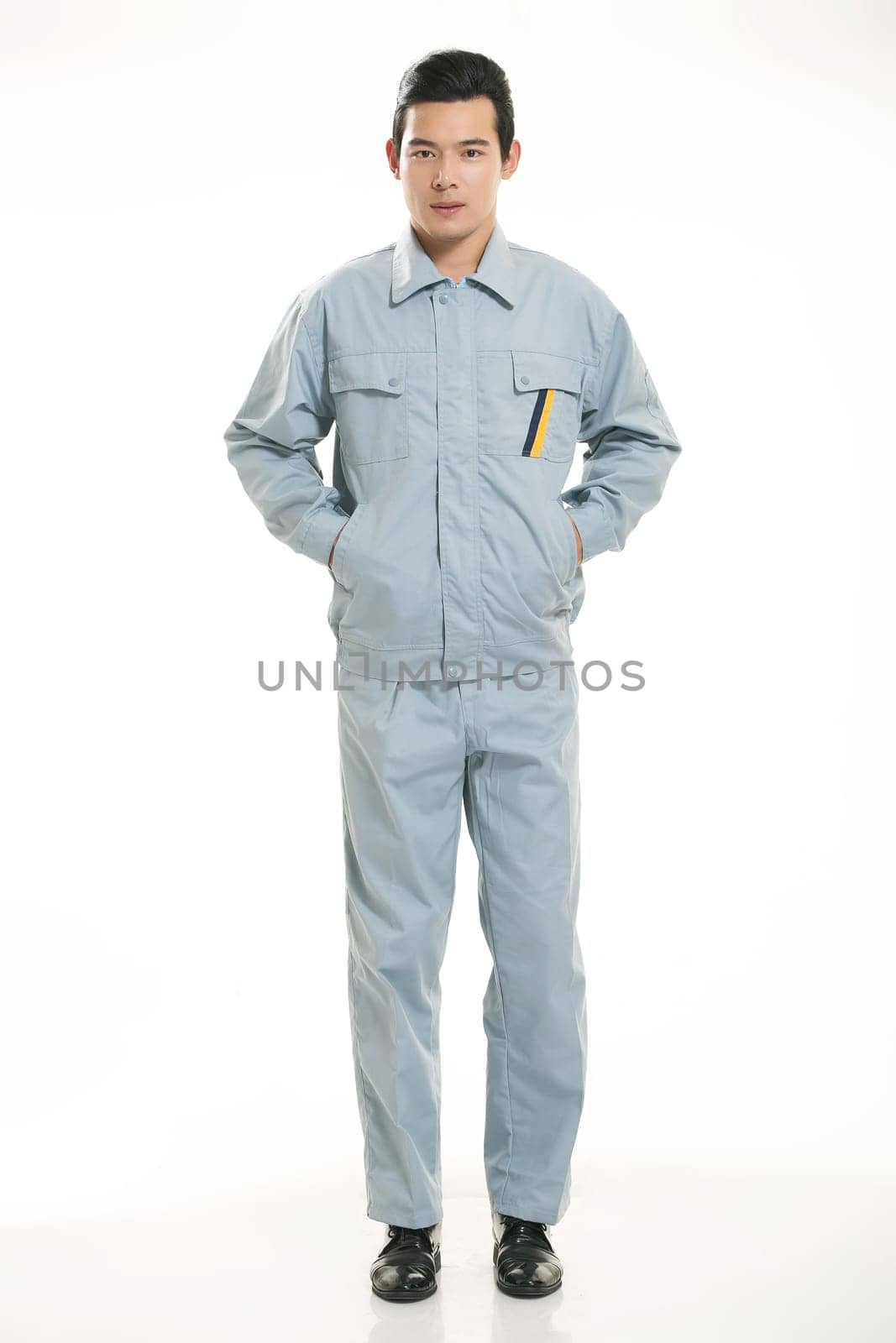 The young engineer various occupation clothing standing in front of a white background