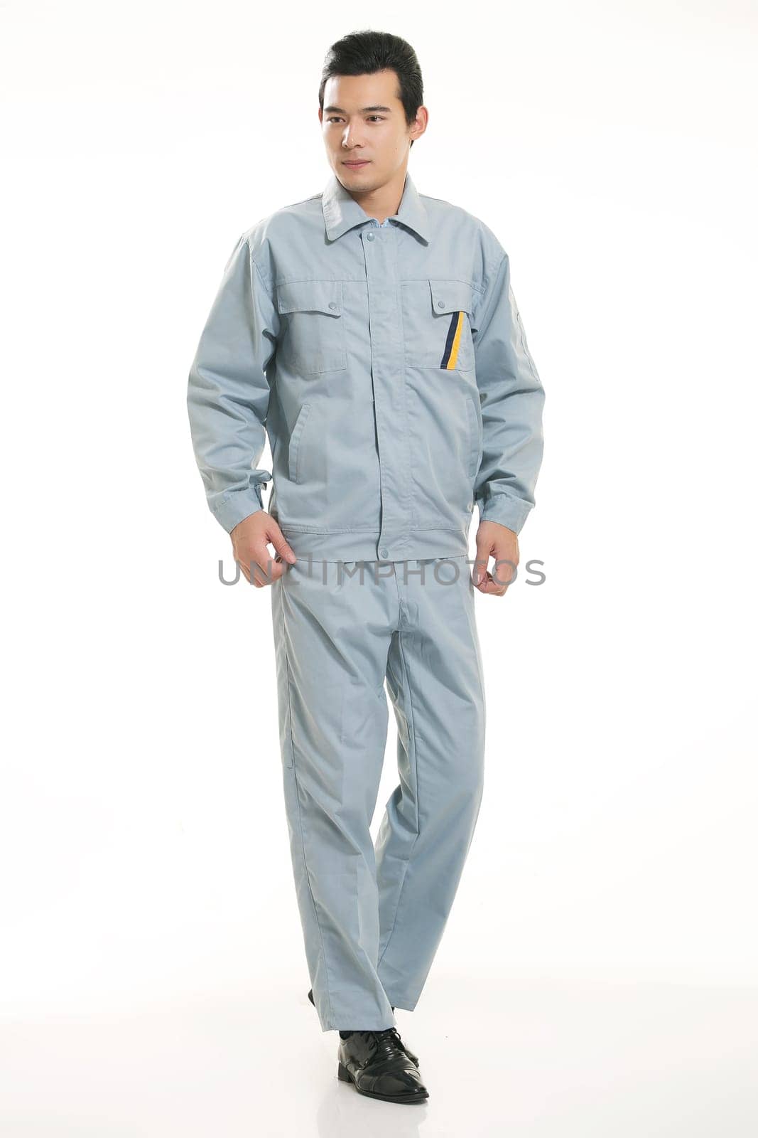 The young engineer various occupation clothing standing in front of a white background