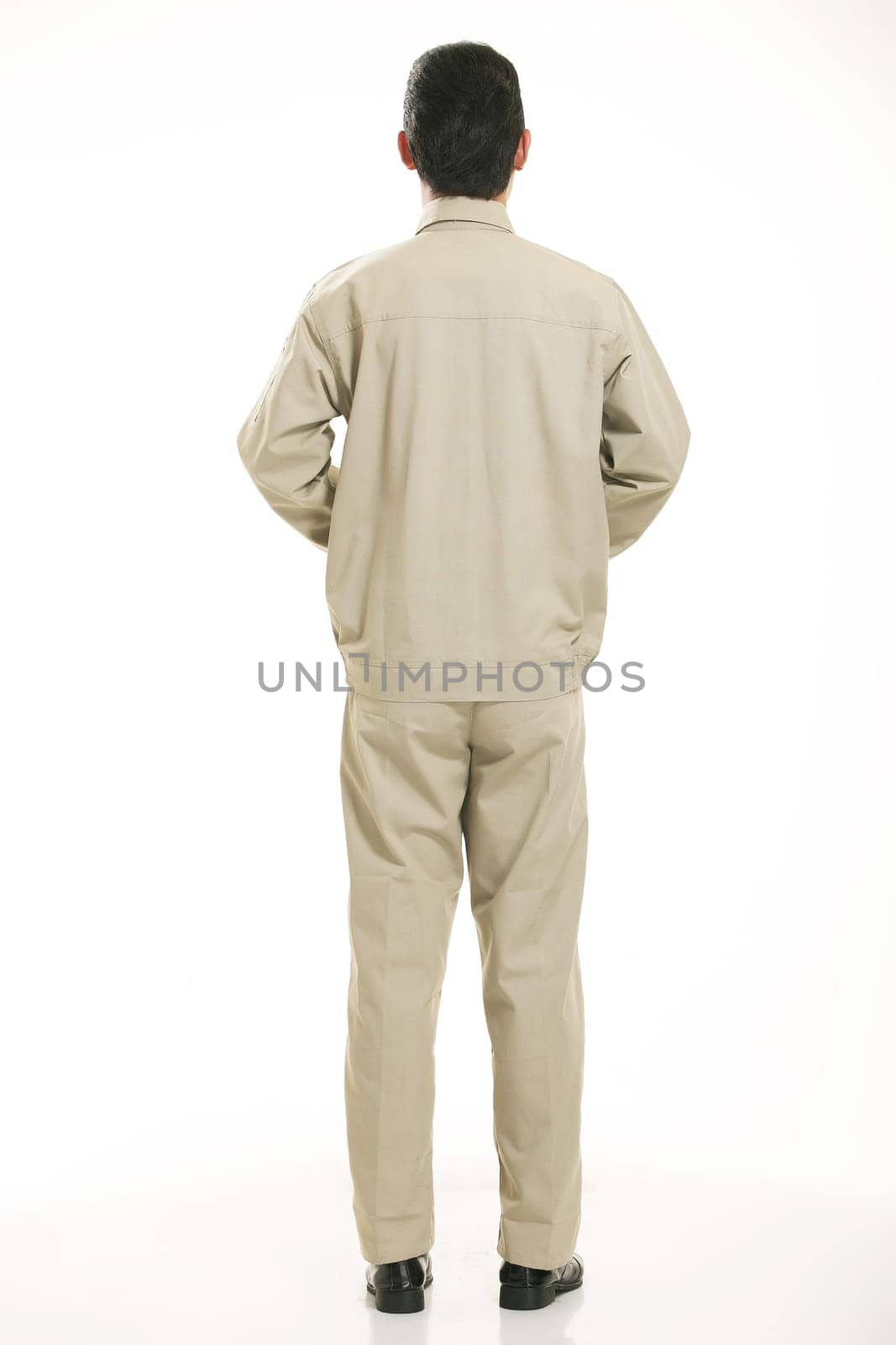 The young engineer various occupation clothing standing in front of a white background