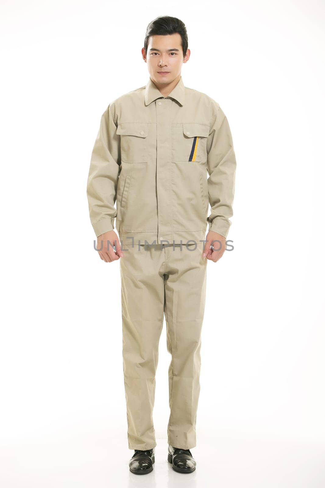The young engineer various occupation clothing standing in front of a white background