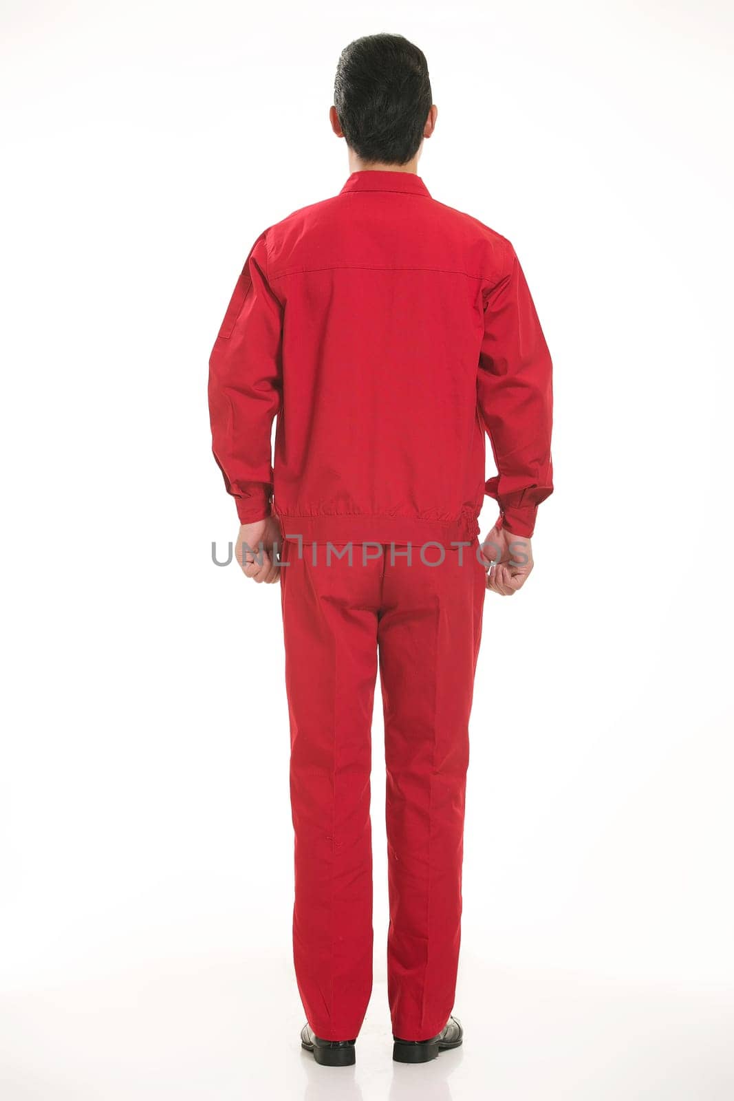 The young engineer various occupation clothing standing in front of a white background