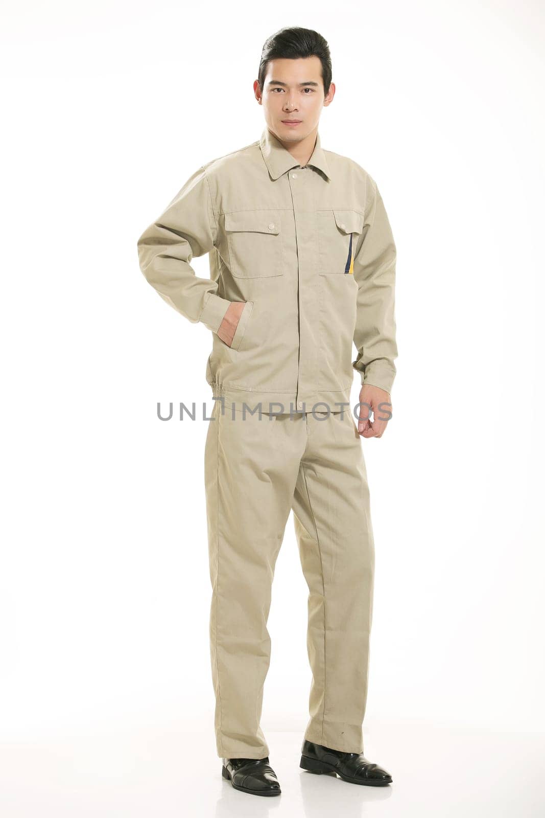 The young engineer various occupation clothing standing in front of a white background
