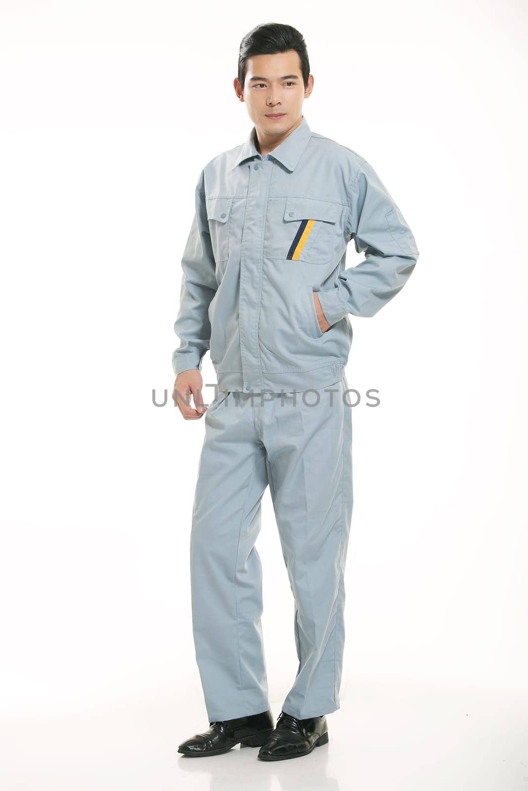 The young engineer various occupation clothing standing in front of a white background