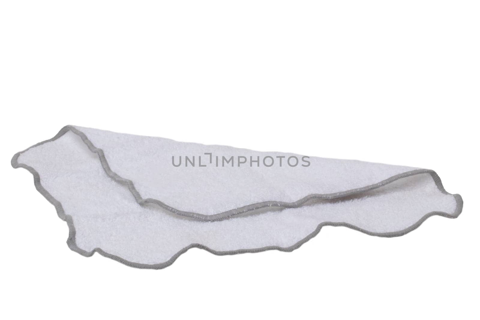 Household cleanliness and hygiene. Close-up of a white cleaning cloth isolated on a white background. Microfiber cleaning cloth. Macro.
