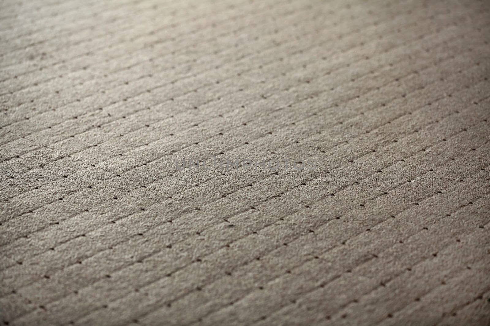Abstract background - shallow depth of field photo - carpet with square texture.