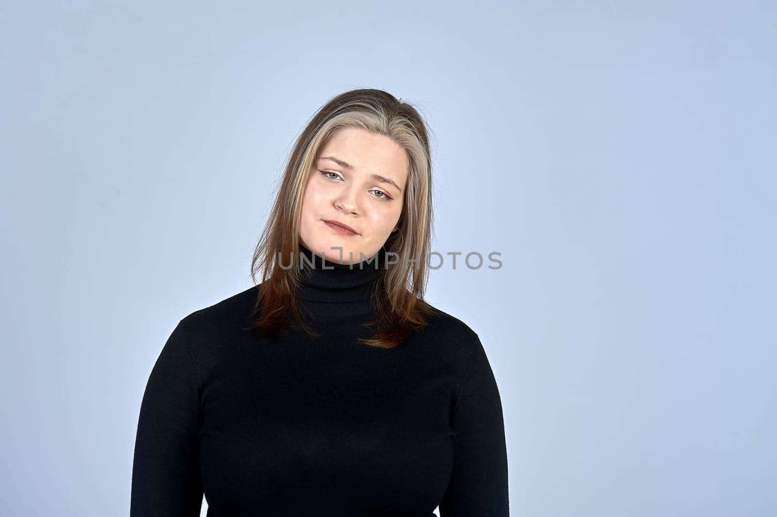 sad woman on the background in a black turtleneck. High quality photo